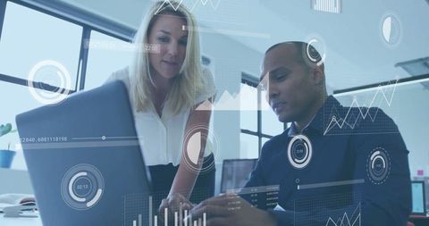 Professionals Collaborating on Data Analysis in Modern Office