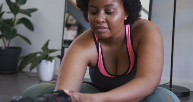 Woman in Activewear Stretching During Home Workout - Download Free Stock Images Pikwizard.com