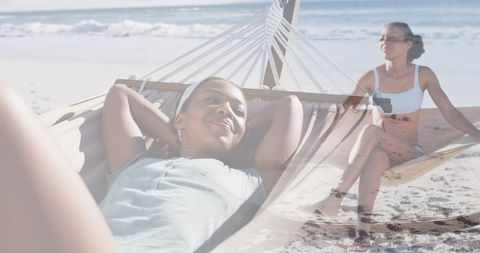 Relaxed African American Woman Lounging in Beachside Hammock - Download Free Stock Images Pikwizard.com
