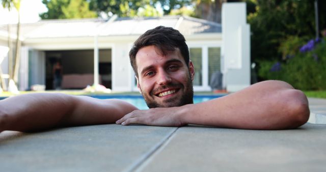 Man Relaxing in Swimming Pool Smiling Outdoors - Download Free Stock Images Pikwizard.com