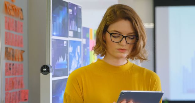 Female Professional Analyzing Data on Tablet in Office - Download Free Stock Images Pikwizard.com