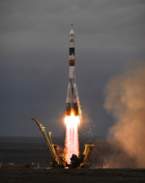 The Soyuz TMA-14 launches from the Baikonur Cosmodrome in Kazakhstan on Thursday, March 26, 2009 carrying Expedition 19 Commander Gennady I. Padalka, Flight Engineer Michael R. Barratt and Spaceflight Participant Charles Simonyi to the International Space Station. (Photo Credit: NASA/Bill Ingalls)