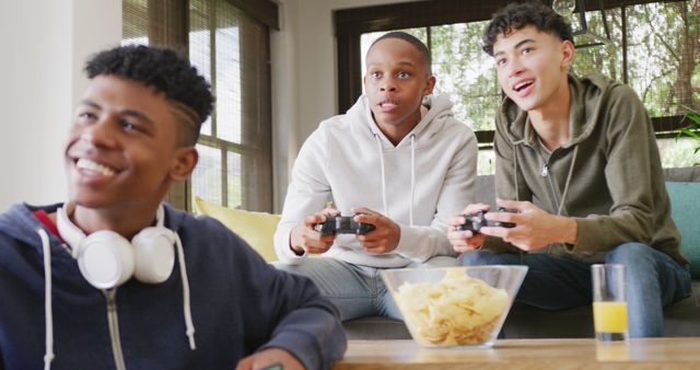 Teenagers enjoying video game session with friends at home - Download Free Stock Images Pikwizard.com