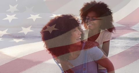 Joyful African American Mother and Daughter on Beach with USA Flag Overlay