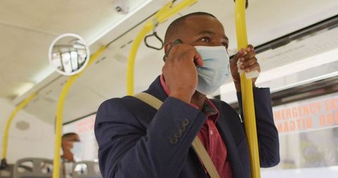 Businessman Wearing Mask Using Smartphone on Bus Amid Pandemic - Download Free Stock Images Pikwizard.com