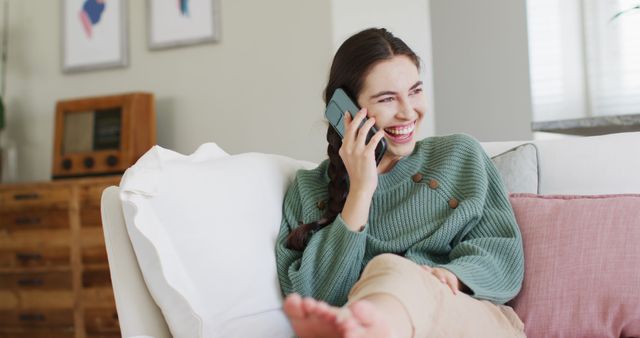 Smiling Woman Talking on Smartphone Relaxing on Couch - Download Free Stock Images Pikwizard.com