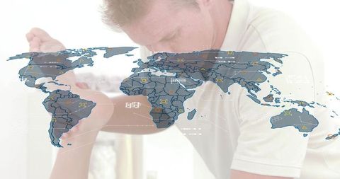 Leaning man comforting partner at home with faint world map overlay and tech graphics