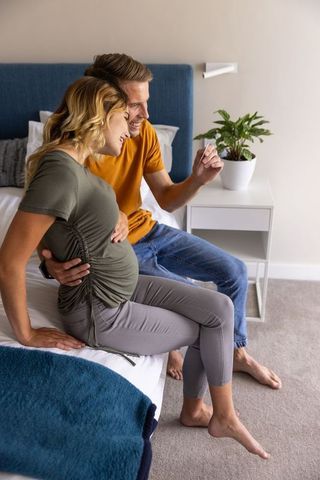 Expectant couple viewing ultrasound cherishing family bond