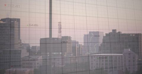 Urban Skyline at Dawn with Digital Grid Overlay