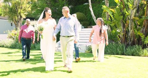 Senior Couple Wedding Celebration with Diverse Friends Outdoors