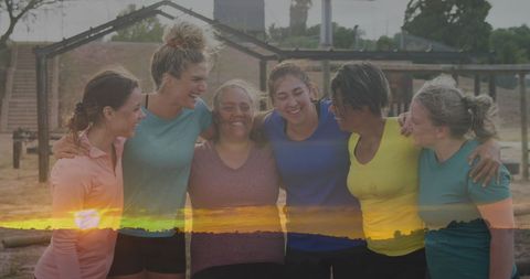 Diverse Group of Women Celebrating at Obstacle Course Sunset