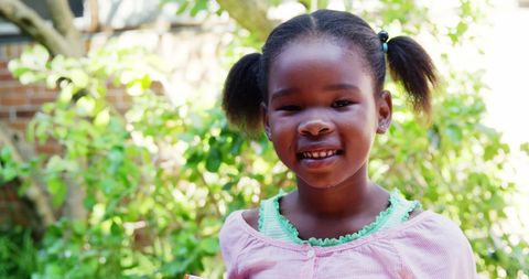 Smiling Schoolgirl Enjoying Sunny Day on Campus