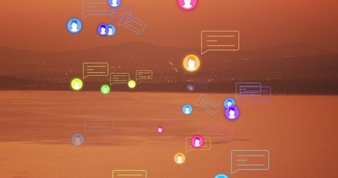 Digital icons overlaying serene sunset sea view