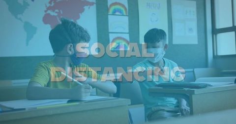 Schoolboys Practicing Elbow Greeting in Classroom Maintaining Social Distancing