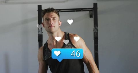 Muscular Fitness Influencer Posing in Gym Showing Social Media Likes and Heart Icons