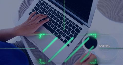 Female typing on laptop while holding coffee cup with HUD overlay, overhead minimalist workspace