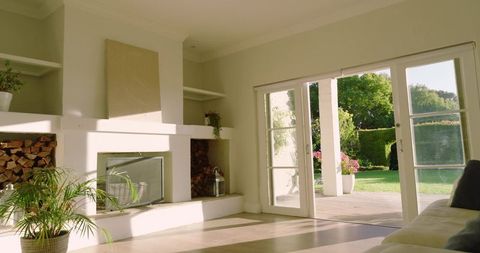 Sunlit Minimalist Living Room with Sliding Glass Doors and Fireplace