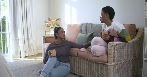 Friends Enjoying Relaxation with Skincare Patches and Beverages