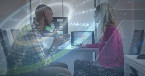 Modern business team analyzing data on digital devices