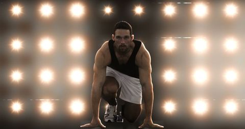 Athlete Poised for Race in Dramatic Spotlight Setting