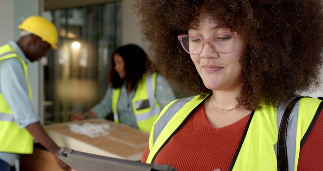 Female Architect with Curly Hair Using Tablet in Modern Office - Download Free Stock Images Pikwizard.com