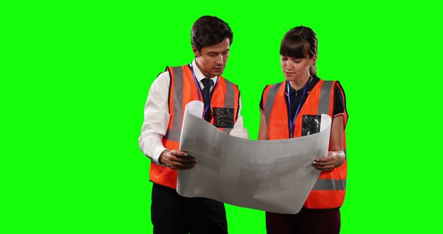 Engineers Discussing Blueprint with Green Screen Background - Download Free Stock Images Pikwizard.com
