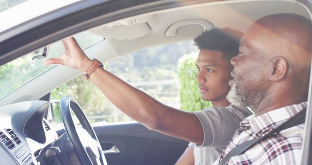 Young Man Receiving Driving Lessons from Experienced Instructor - Download Free Stock Images Pikwizard.com