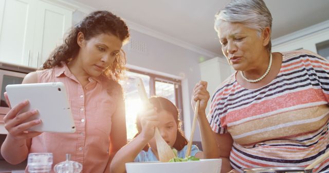 Three Generations Cook Together Using Tablet in Modern Kitchen - Download Free Stock Images Pikwizard.com