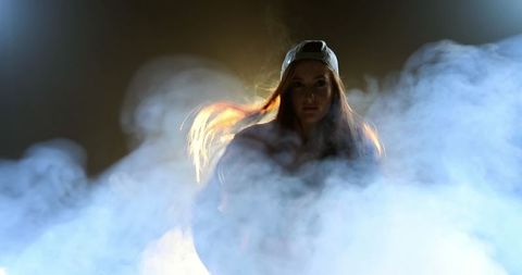 Young Caucasian Woman Embraced by Smoke in Emotional Dance - Download Free Stock Images Pikwizard.com