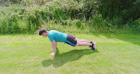 Man Push-Up Exercise Outdoors in Sunny Park Setting
