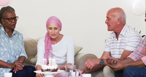 Senior Friends Celebrating Birthday with Cake and Coffee Gathering