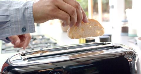 Preparing Breakfast in Modern Kitchen with Toaster and Bread