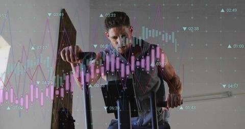 Man pedaling on assault bike with candlestick fitness data overlay and analytics
