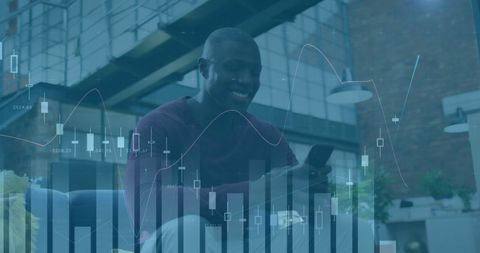 smiling businessman using smartphone with financial graphs overlay - Download Free Stock Images Pikwizard.com