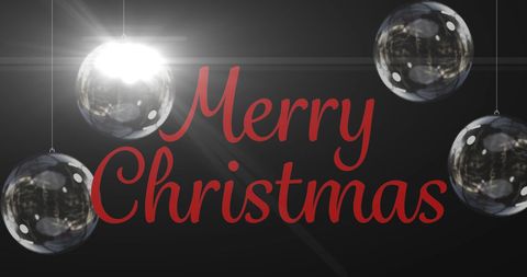 Merry christmas text with shiny ornaments