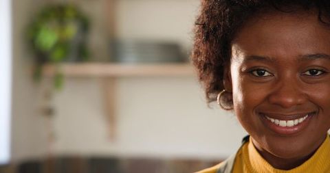 Joyful Woman Preparing a Meal in Cozy Home Kitchen