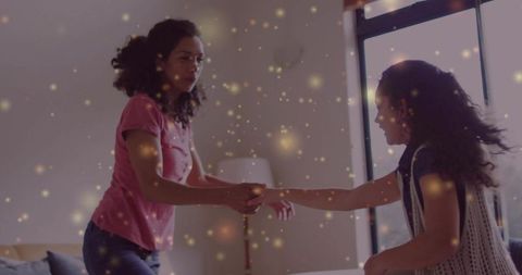 Joyful Mother and Daughter Celebrating in Living Room