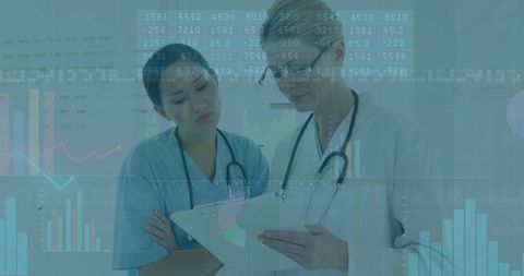 Doctors Analyzing Data Overlays in Modern Medical Setting