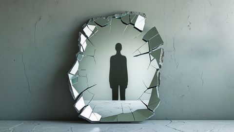 Introspective silhouette and broken mirror artistry