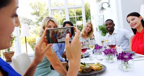 Capturing Memories at Lively Social Gathering with Friends - Download Free Stock Images Pikwizard.com
