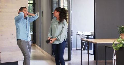 Cheerful Colleagues Celebrating at Modern Office