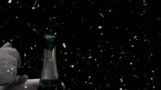 A celebratory scene featuring a champagne bottle with a vibrant backdrop of falling confetti, perfect for capturing the essence of party celebrations. Ideal for New Year's Eve promotions, party invitations, or festive advertisements. Use this dynamic image to add a touch of excitement and festivity to any event-related project.