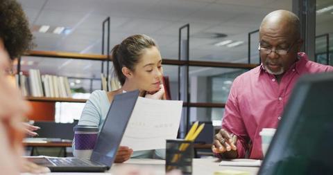 Team Meeting in Modern Office with Focused Employees Discussing Documents - Download Free Stock Images Pikwizard.com