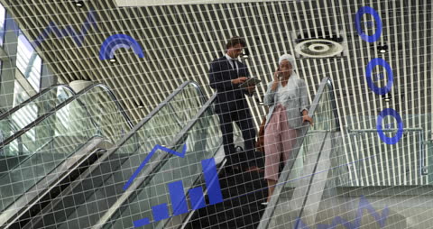 Business Team Analyzing Financial Data on Office Escalator