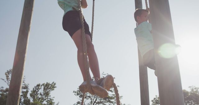 Youth Climbing Rope Outdoors on Sunny Day - Download Free Stock Images Pikwizard.com