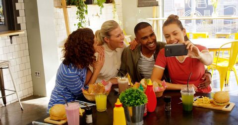 Friends Taking Selfie Enjoying Meal in Trendy Cafe - Download Free Stock Images Pikwizard.com