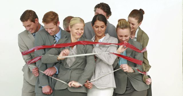 Smiling Business Team Knotted in Red Tape During Team Building Activity - Download Free Stock Images Pikwizard.com