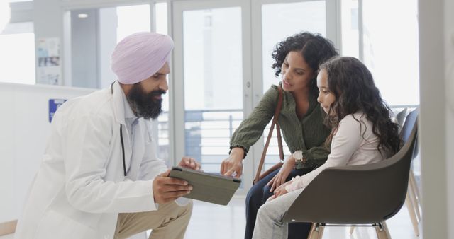 Doctor Explaining Treatment to Mother and Daughter in Hospital - Download Free Stock Images Pikwizard.com