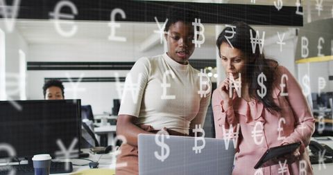 Diverse Women Analyzing Finance with Global Currency Symbols