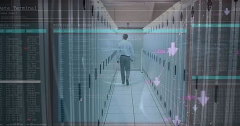 IT Engineer Analyzing Data in High-Tech Server Room Environment